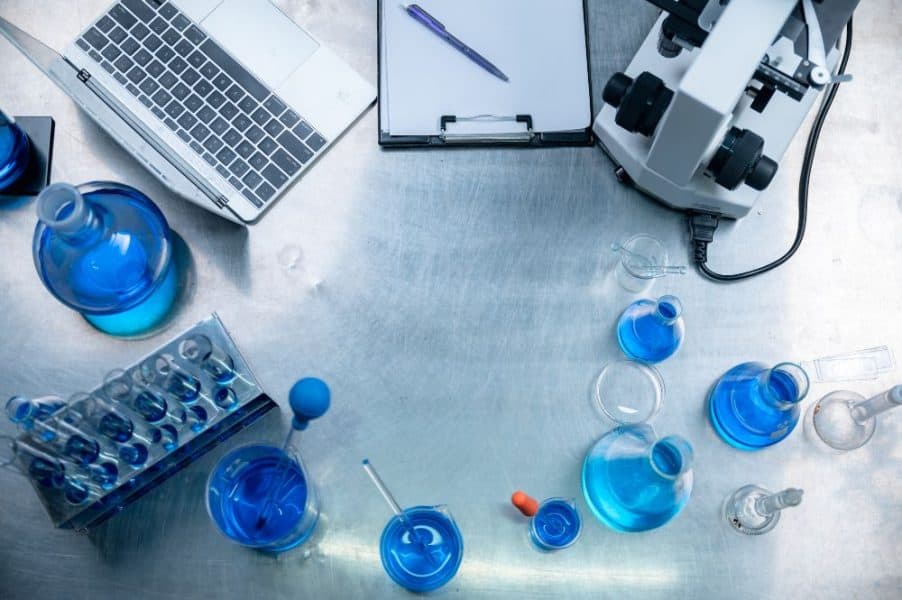 Laboratory science equipment and glassware for medical research and testing.
