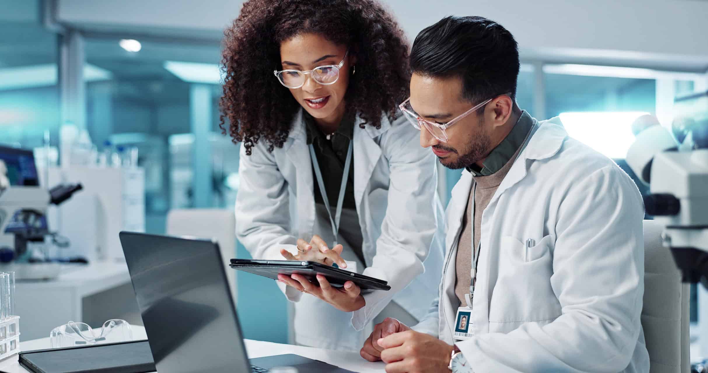 Innovative medical scientists collaborating in a high-tech laboratory, emphasizing MedTech advancements and healthcare innovation.
