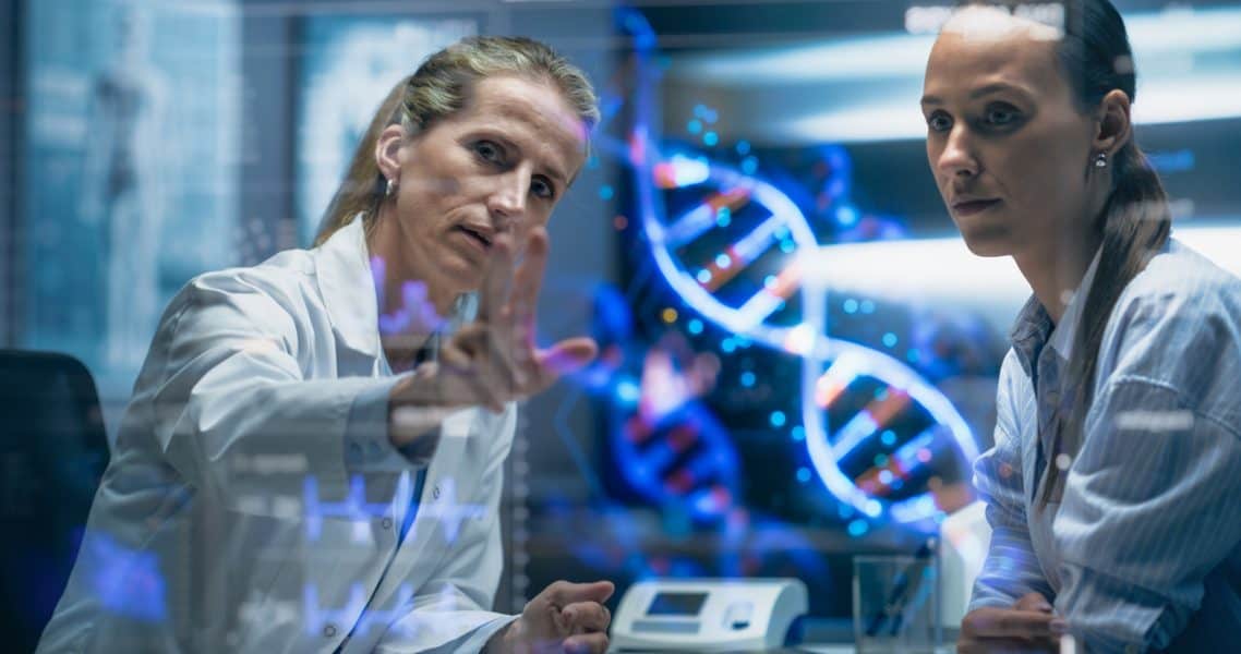 Advanced medical researchers analyzing DNA models to accelerate innovations in MedTech and improve healthcare solutions.