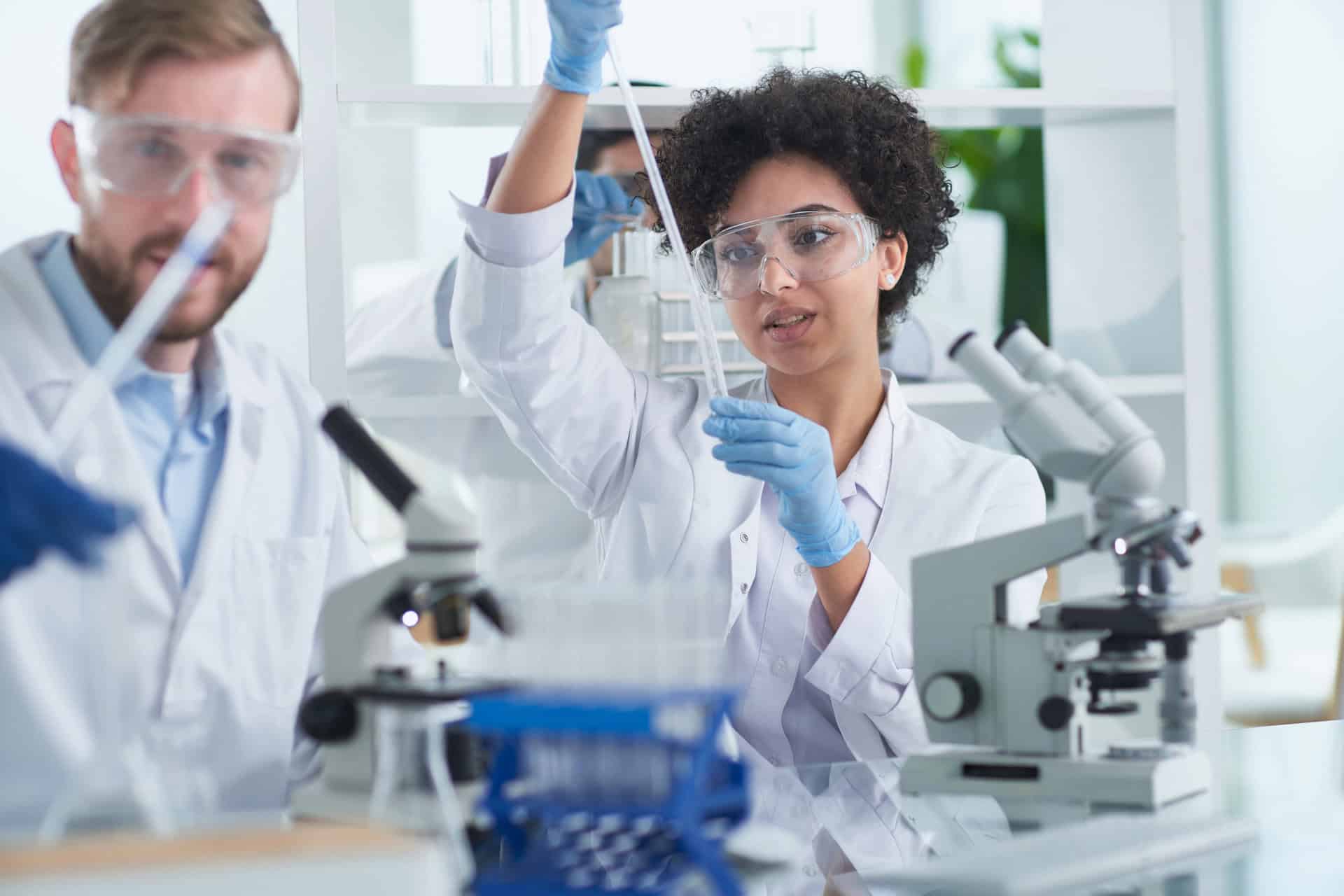 Advanced medical researchers conducting laboratory experiments to accelerate medical technology development for healthcare innovation.