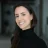 Innovative woman smiling, representing MedTech innovation and leadership, with a focus on MDX Accelerating MedTech initiatives and strategies in healthcare technology.